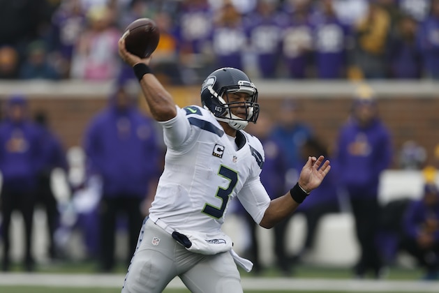 Seattle Seahawks quarterback Russell Wilson (3) throws against the Minnesota Vikings in the first half of an NFL football game Sunday, Dec. 6, 2015 in Minneapolis. (AP Photo/Jim Mone)
