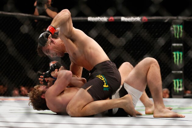 LAS VEGAS, NV - DECEMBER 12: Demian Maia of Brazil (top) punches Gunnar Nelson of Iceland in their welterweight bout during the UFC 194 event inside MGM Grand Garden Arena on December 12, 2015 in Las Vegas, Nevada.  (Photo by Christian Petersen/Zuffa LLC/Zuffa LLC via Getty Images)