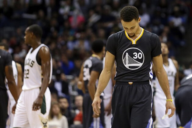 Golden State Warriors' Stephen Curry looks down during the second half of an NBA basketball game against the Milwaukee Bucks, Saturday, Dec. 12, 2015, in Milwaukee. The Bucks won 108-95. (AP Photo/Aaron Gash)