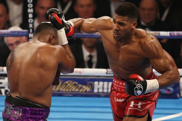 British boxer Anthony Joshua (R) vies against British boxer Dillian Whyte during their British and Commonwealth heavyweight title boxing match at the O2 arena in London on December 12, 2015. AFP PHOTO / JUSTIN TALLIS / AFP / JUSTIN TALLIS        (Photo credit should read JUSTIN TALLIS/AFP/Getty Images)