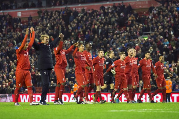 Liverpool's manager Juergen Klopp, second left, celebrates with his players after their 2-2 draw against West Bromwich Albion during the English Premier League soccer match between Liverpool and West Bromwich Albion at Anfield Stadium, Liverpool, England, Sunday, Dec. 13, 2015. (AP Photo/Jon Super)