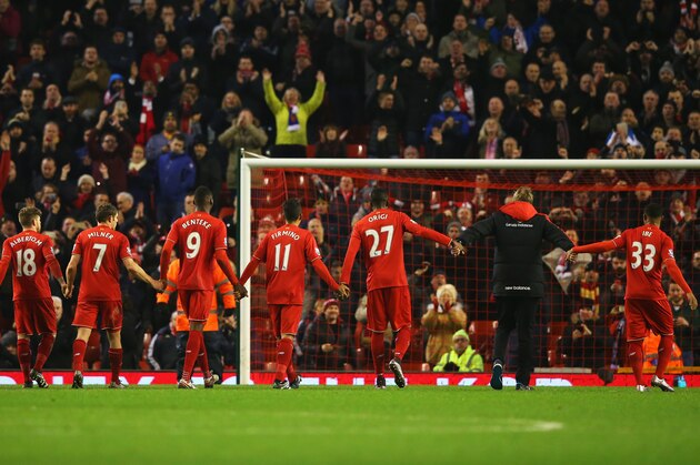 LIVERPOOL, ENGLAND - DECEMBER 13:  Jurgen Klopp, manager of Liverpool and player salute The Kop after the Barclays Premier League match between Liverpool and West Bromwich Albion at Anfield on December 13, 2015 in Liverpool, England.  (Photo by Alex Livesey/Getty Images)