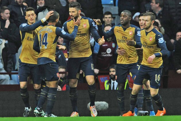 Arsenal’s Olivier Giroud, 3rd left, is congratulated by teammates after scoring from the penalty spot during the English Premier League soccer match between Aston Villa and Arsenal at Villa Park in Birmingham, England, Sunday, Dec. 13, 2015. (AP Photo/Rui Vieira)