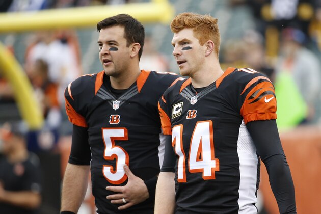 Cincinnati Bengals quarterback Andy Dalton (14) stands with quarterback AJ McCarron (5) during practice before an NFL football game against the Pittsburgh Steelers, Sunday, Dec. 13, 2015, in Cincinnati. (AP Photo/Frank Victores)