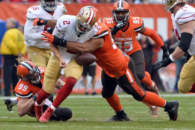 Dec 13, 2015; Cleveland, OH, USA; Cleveland Browns defensive end Desmond Bryant (92) forces a fumble on San Francisco 49ers quarterback Blaine Gabbert (2) during the second quarter at FirstEnergy Stadium. Mandatory Credit: Ken Blaze-USA TODAY Sports