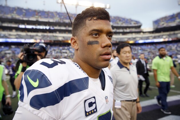 Seattle Seahawks quarterback Russell Wilson (3) pauses after an NFL football game against the Baltimore Ravens, Sunday, Dec. 13, 2015, in Baltimore. The Seahawks won 35-6. (AP Photo/Patrick Semansky)
