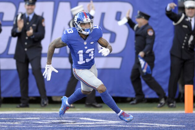 New York Giants wide receiver Odell Beckham (13) celebrates after scoring a touchdown during the first half of an NFL football game against the New York Jets Sunday, Dec. 6, 2015, in East Rutherford, N.J. (AP Photo/Bill Kostroun)