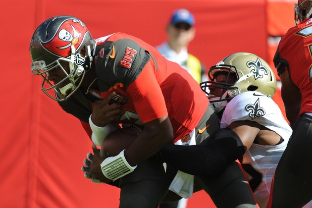 TAMPA, FL - DECEMBER 13: Quarterback Jameis Winston #3 of the Tampa Bay Buccaneers is sacked by defensive end Obum Gwacham #58 of the New Orleans Saints in the first quarter at Raymond James Stadium on December 13, 2015 in Tampa, Florida. (Photo by Cliff McBride/Getty Images)