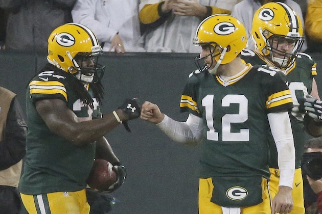 Green Bay Packers' Eddie Lacy is congratulated by Aaron Rodgers (12) after Lacy's touchdown run during the second half of an NFL football game against the Dallas Cowboys Sunday, Dec. 13, 2015, in Green Bay, Wis. (AP Photo/Mike Roemer)