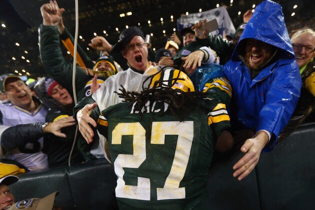 GREEN BAY, WI - DECEMBER 13:   Eddie Lacy #27 of the Green Bay Packers celebrates his touchdown against the Dallas Cowboys in the fourth quarter at Lambeau Field on December 13, 2015 in Green Bay, Wisconsin.  (Photo by Ronald Martinez/Getty Images)