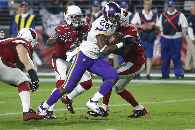 Minnesota Vikings running back Adrian Peterson (28) runs in for his 100th career touchdown against the Arizona Cardinals during the first half of an NFL football game, Thursday, Dec. 10, 2015, in Glendale, Ariz. (AP Photo/Rick Scuteri)