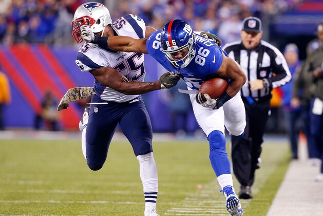 EAST RUTHERFORD, NJ - NOVEMBER 15:  (NEW YORK DAILIES OUT)    Jerome Cunningham #86 of the New York Giants in action against Jonathan Freeny #55 of the New England Patriots on November 15, 2015 at MetLife Stadium in East Rutherford, New Jersey. The Patriots defeated the Giants 27-26.  (Photo by Jim McIsaac/Getty Images)
