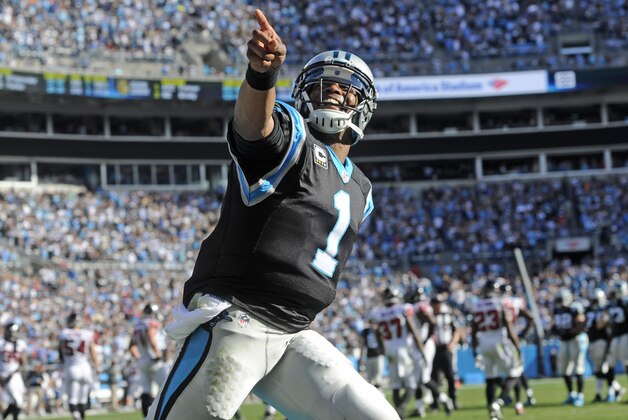 Dec 13, 2015; Charlotte, NC, USA; Carolina Panthers quarterback Cam Newton (1) celebrates after his team scores a touchdown during the first half of the game against the Atlanta Falcons at Bank of America Stadium. Mandatory Credit: Sam Sharpe-USA TODAY Sports