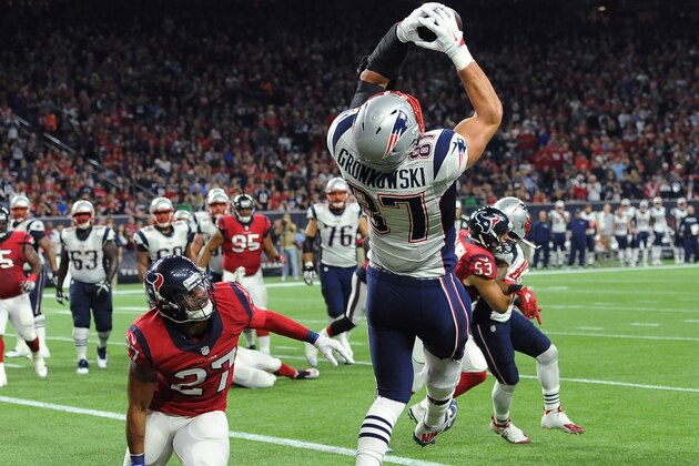 New England Patriots tight end Rob Gronkowski (87) catches a pass for a touchdown over Houston Texans strong safety Quintin Demps (27) during the first hall of an NFL football game Sunday,  Dec. 13, 2015, in Houston. (AP Photo/George Bridges)