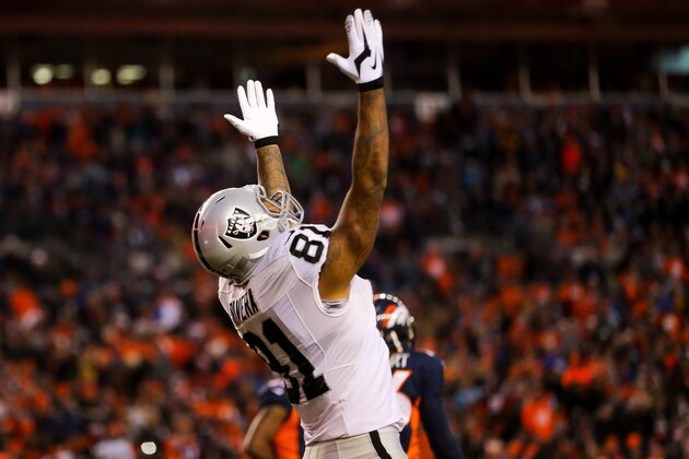DENVER, CO - DECEMBER 13:  Tight end Mychal Rivera #81 of the Oakland Raiders celebrates after a 16 yard fourth quarter touchdown reception for  at Sports Authority Field at Mile High on December 13, 2015 in Denver, Colorado.  (Photo by Justin Edmonds/Getty Images)