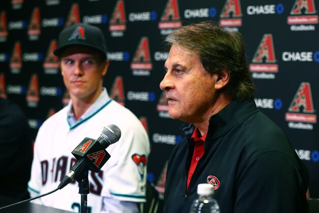 Dec 11, 2015; Phoenix, AZ, USA; Arizona Diamondbacks pitcher Zack Greinke (left) looks on as chief baseball officer Tony La Russa speaks during a press conference at Chase Field . Mandatory Credit: Mark J. Rebilas-USA TODAY Sports