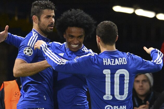 Chelsea's Brazilian midfielder Willian (C) celebrates with Chelsea's Brazilian-born Spanish striker Diego Costa (L) and Chelsea's Belgian midfielder Eden Hazard (R) after Willian scored their second goal during the UEFA Champions League Group G football match between Chelsea and Porto at Stamford Bridge in London on December 9, 2015.  AFP PHOTO / GLYN KIRK / AFP / GLYN KIRK        (Photo credit should read GLYN KIRK/AFP/Getty Images)