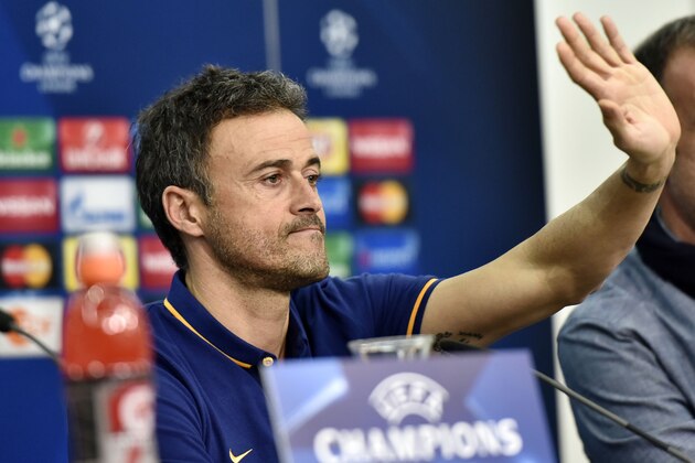 Barcelona's head coach Luis Enrique waves  to the media during a press conference prior the Champions League group E soccer match between Bayer Leverkusen and FC Barcelona in Leverkusen, Germany, Tuesday, Dec. 8, 2015. (AP Photo/Martin Meissner)