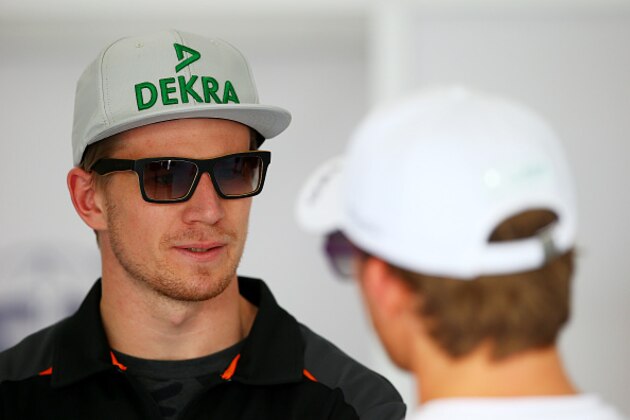 KUALA LUMPUR, MALAYSIA - MARCH 29:  Nico Hulkenberg of Germany and Force India speaks with Nico Rosberg of Germany and Mercedes GP before the drivers' parade before the Malaysia Formula One Grand Prix at Sepang Circuit on March 29, 2015 in Kuala Lumpur, Malaysia.  (Photo by Mark Thompson/Getty Images)