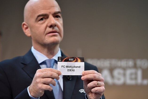 UEFA General Secretary Gianni Infantino shows the name of FC Midtjylland football club during the draw for the UEFA Europa league round of sixteen, on December 14, 2015 at the UEFA headquarters in Nyon. AFP PHOTO / FABRICE COFFRINI / AFP / FABRICE COFFRINI (Photo credit should read FABRICE COFFRINI/AFP/Getty Images) UEFA General Secretary Gianni Infantino shows the name of FC Midtjylland football club during the draw for the UEFA Europa league round of sixteen, on December 14, 2015 at the UEFA headquarters in Nyon. AFP PHOTO / FABRICE COFFRINI / AFP / FABRICE COFFRINI (Photo credit should read FABRICE COFFRINI/AFP/Getty Images)