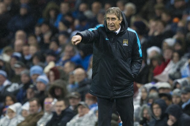 Manchester City's manager Manuel Pellegrini urges on his players during the English Premier League soccer match between Manchester City and Swansea City at the Etihad Stadium, Manchester, England, Saturday Dec. 12, 2015. (AP Photo/Jon Super)