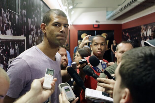 Miami Heat's Shane Battier talks to reporters  during a news conference in Miami, Tuesday, June 17, 2014. The Miami Heat held their season-wrapup team meeting on Tuesday afternoon and one of the biggest questions is about the future of the roster. LeBron James could become a free agent in a couple of weeks and the four-time MVP says he still has not thought about his plans.(AP Photo/Alan Diaz)
