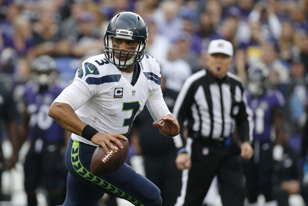 Seattle Seahawks quarterback Russell Wilson looks for a receiver during an NFL football game against the Baltimore Ravens, Sunday, Dec. 13, 2015, in Baltimore. (AP Photo/Patrick Semansky)