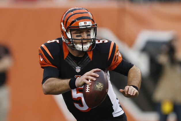 Cincinnati Bengals quarterback AJ McCarron (5) looks to pass on the run in the second half of an NFL football game against the Pittsburgh Steelers, Sunday, Dec. 13, 2015, in Cincinnati. (AP Photo/Gary Landers)