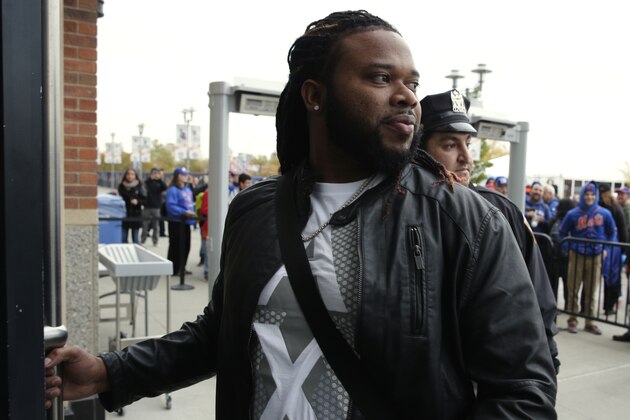Kansas City Royals pitcher Johnny Cueto arrives at Citi Field before Game 4 of the Major League Baseball World Series between the New York Mets and the Kansas City Royals Saturday, Oct. 31, 2015, in New York. (AP Photo/Peter Morgan)