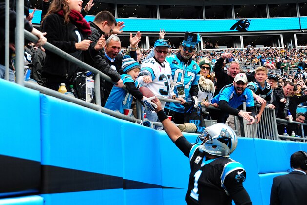 CHARLOTTE, NC - NOVEMBER 8: Cam Newton #1 of the Carolina Panthers hands the football to a young fan after scoring a touchdown against the Green Bay Packers at Bank Of America Stadium on November 8, 2015 in Charlotte, North Carolina. (Photo by Scott Cunningham/Getty Images)