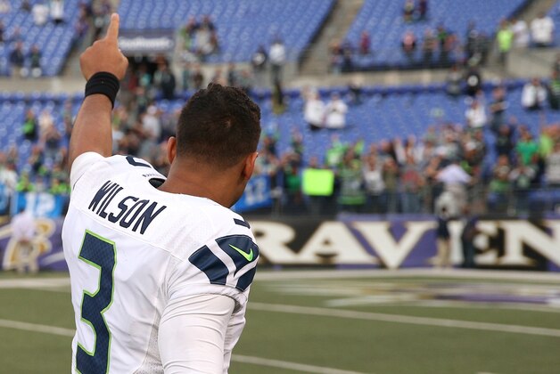 BALTIMORE, MD - DECEMBER 13: Quarterback Russell Wilson #3 of the Seattle Seahawks acknowledges the crowd after defeating the Baltimore Ravens 35-6 at M&T Bank Stadium on December 13, 2015 in Baltimore, Maryland. (Photo by Patrick Smith/Getty Images)