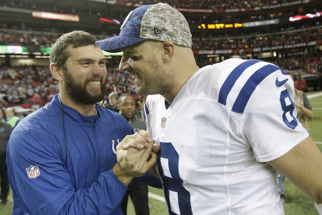 Indianapolis Colts quarterback Andrew Luck celebrates with Indianapolis Colts quarterback Matt Hasselbeck (8) after an NFL football game against the Atlanta Falcons, Sunday, Nov. 22, 2015, in Atlanta. The Indianapolis Colts won 24-21. (AP Photo/David Goldman)