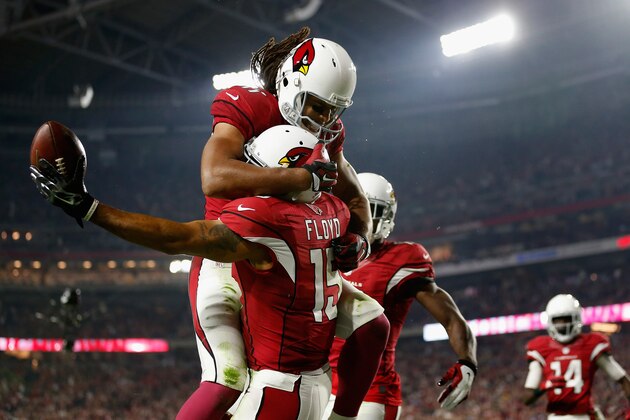 GLENDALE, AZ - DECEMBER 10:  Wide receiver Michael Floyd #15 of the Arizona Cardinals celebrates with wide receiver Larry Fitzgerald #11 after scoring a 42 yard touchdown during the third quarter of the NFL game against the Minnesota Vikings at the University of Phoenix Stadium on December 10, 2015 in Glendale, Arizona. The Cardinals defeated the Vikings 23-20. (Photo by Christian Petersen/Getty Images)