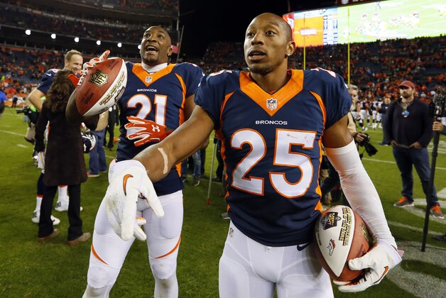 Denver Broncos cornerback Chris Harris (25) and Denver Broncos cornerback Aqib Talib (21) celebrate after an NFL football game against the Green Bay Packers, Sunday, Nov. 1, 2015, in Denver. The Broncos won 29-10 to improve to 7-0. (AP Photo/Joe Mahoney)