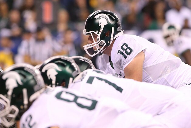 Dec 5, 2015; Indianapolis, IN, USA; Michigan State Spartans quarterback Connor Cook (18) against the Iowa Hawkeyes in the Big Ten Conference football championship game at Lucas Oil Stadium. Mandatory Credit: Aaron Doster-USA TODAY Sports