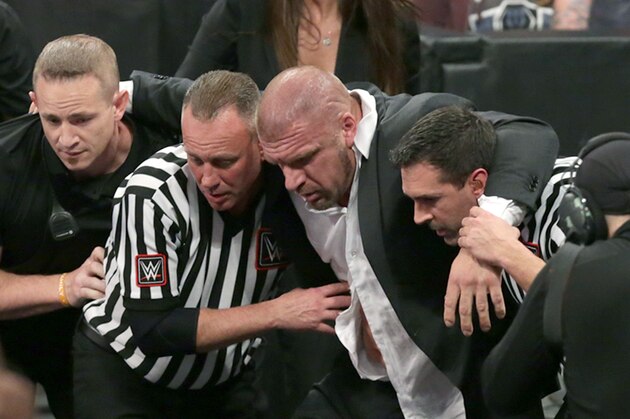 Triple H helped from the ring at TLC Triple H helped from the ring at TLC