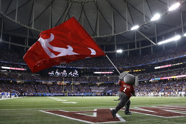 ATLANTA, GA - DECEMBER 5: Mascot Big Al of the Alabama Crimson Tide carries a flag across the field in the third quarter during the SEC Championship game against the Florida Gators at the Georgia Dome on December 5, 2015 in Atlanta, Georgia. (Photo by Mike Zarrilli/Getty Images)