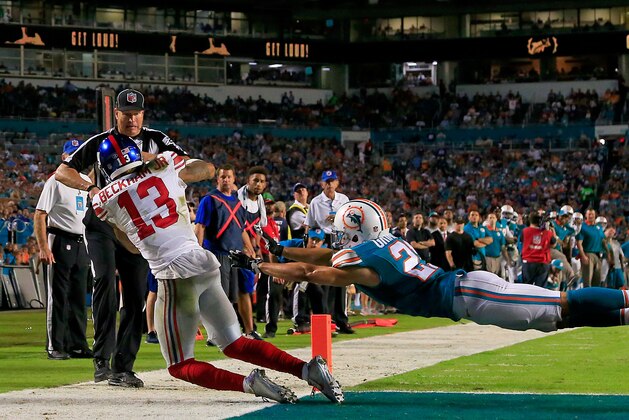 MIAMI GARDENS, FL - DECEMBER 14: Odell Beckham #13 of the New York Giants catches a touchdown pass as Brent Grimes #21 of the Miami Dolphins defends during the third quarter of the game at Sun Life Stadium on December 14, 2015 in Miami Gardens, Florida.  (Photo by Chris Trotman/Getty Images)