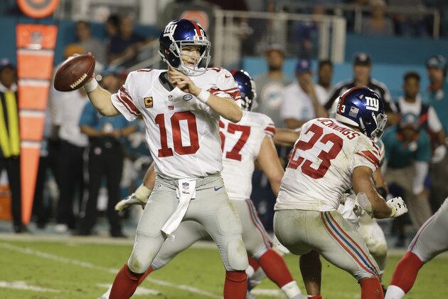 New York Giants quarterback Eli Manning (10) looks to pass during the second half of an NFL football gameagainst the Miami Dolphins, Monday, Dec. 14, 2015, in Miami Gardens, Fla.  (AP Photo/Lynne Sladky)