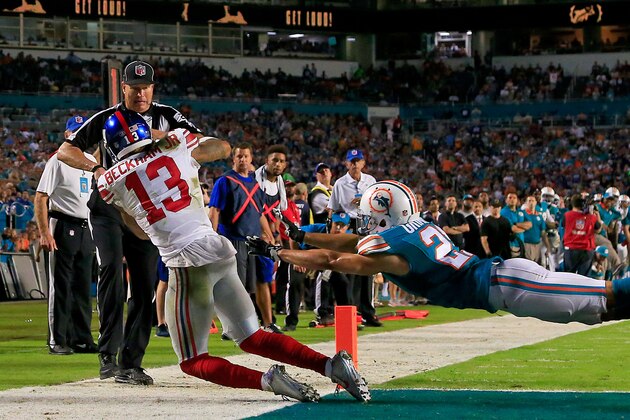 MIAMI GARDENS, FL - DECEMBER 14: Odell Beckham #13 of the New York Giants catches a touchdown pass as Brent Grimes #21 of the Miami Dolphins defends during the third quarter of the game at Sun Life Stadium on December 14, 2015 in Miami Gardens, Florida.  (Photo by Chris Trotman/Getty Images)