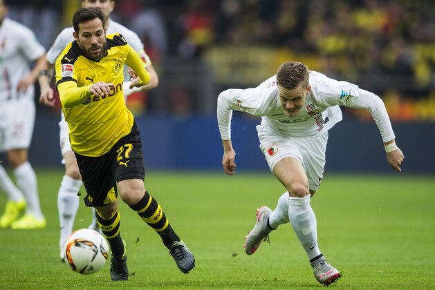 Augsburg's defender Philipp Max and Dortmund's midfielder Gonzalo Castro (L) vie for the ball during the German first division football Bundesliga match between Borussia Dortmund and FC Augsburg on October 25, 2015 in Dortmund, western Germany. AFP PHOTO / ODD ANDERSEN
RESTRICTIONS: DURING MATCH TIME: DFL RULES TO LIMIT THE ONLINE USAGE TO 15 PICTURES PER MATCH AND FORBID IMAGE SEQUENCES TO SIMULATE VIDEO. 
==RESTRICTED TO EDITORIAL USE ==
FOR FURTHER QUERIES PLEASE CONTACT THE DFL DIRECTLY AT + 49 69 650050.        (Photo credit should read ODD ANDERSEN/AFP/Getty Images)
