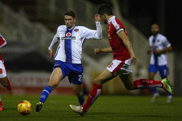 SWINDON, ENGLAND - NOVEMBER 24: George Evans (L) of Walsall reaches the ball ahead of Raphael Rossi-Branco (R) of Swindon Townduring the Sky Bet League One match between Swindon Town and Walsall at the County Ground on November 24, 2015 in Swindon, United Kingdom.  (Photo by Michael Steele/Getty Images)