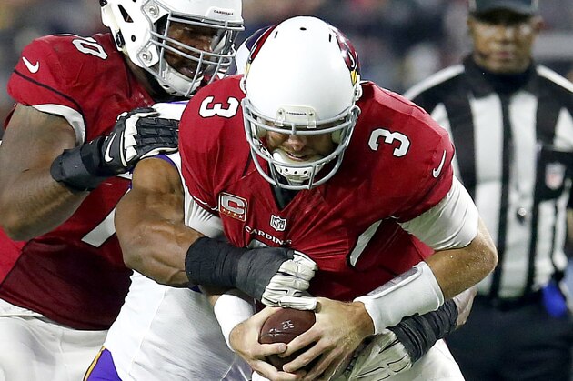 Arizona Cardinals quarterback Carson Palmer (3) is sacked by Minnesota Vikings defensive end Danielle Hunter (99) during the first half of an NFL football game, Thursday, Dec. 10, 2015, in Glendale, Ariz. (AP Photo/Rick Scuteri)