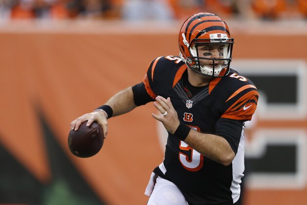 Cincinnati Bengals quarterback AJ McCarron (5) looks to pass on the run in the second half of an NFL football game against the Pittsburgh Steelers, Sunday, Dec. 13, 2015, in Cincinnati. (AP Photo/Gary Landers)