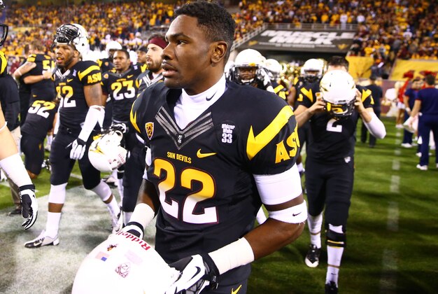 Nov 30, 2013; Tempe, AZ, USA; Arizona State Sun Devils safety Jayme Otomewo (22) against the Arizona Wildcats in the 87th annual Territorial Cup at Sun Devil Stadium. Mandatory Credit: Mark J. Rebilas-USA TODAY Sports