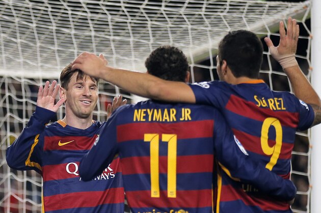 FC Barcelona's Lionel Messi, left, celebrates after scored with his teammates Luis Suarez, right, and Neymar, center, during a Spanish La Liga soccer match against Real Sociedad at the Camp Nou stadium in Barcelona, Spain, Saturday, Nov. 28, 2015. (AP Photo/Manu Fernandez)