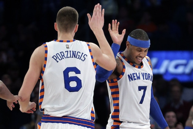 New York Knicks forward Kristaps Porzingis (6) gets a high five from forward Carmelo Anthony (7) during the fourth quarter of an NBA basketball game against the Charlotte Hornets, Tuesday, Nov. 17, 2015, in New York.  The Knicks won 102-94. (AP Photo/Julie Jacobson)