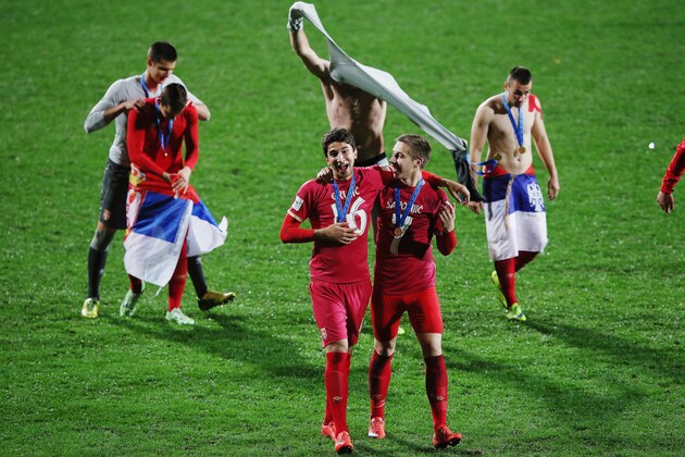 AUCKLAND, NEW ZEALAND - JUNE 20:  Marko Grujic of Serbia and Ivan Saponjic of Serbia celebrate after winning the FIFA U-20 World Cup Final match between Brazil and Serbia at North Harbour Stadium on June 20, 2015 in Auckland, New Zealand.  (Photo by Hannah Peters/Getty Images)