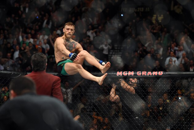 LAS VEGAS, NEVADA - DECEMBER 12:  Conor McGregor of Ireland celebrates after defeating Jose Aldo of Brazil in their featherweight championship bout during the UFC 194 event inside MGM Grand Garden Arena on December 12, 2015 in Las Vegas, Nevada.  (Photo by Jeff Bottari/Zuffa LLC/Zuffa LLC via Getty Images)