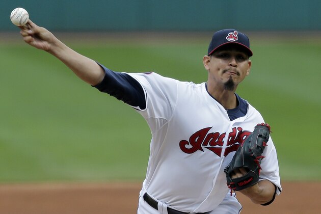 Cleveland Indians starting pitcher Carlos Carrasco delivers in the first inning of the first baseball game of a doubleheader against the Minnesota Twins, Wednesday, Sept. 30, 2015, in Cleveland. (AP Photo/Tony Dejak)